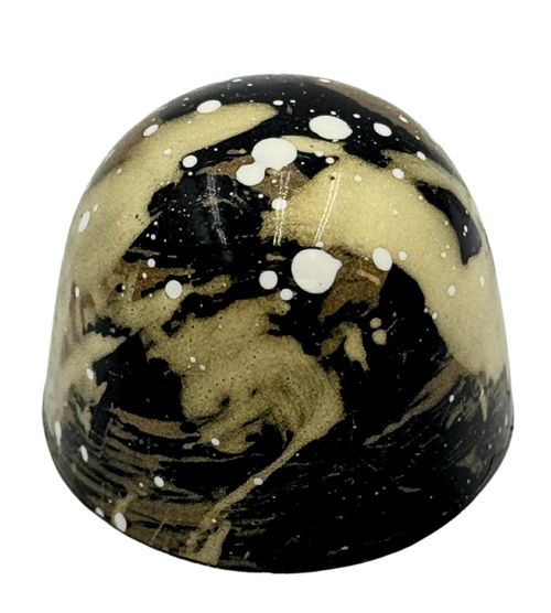 Marble-patterned bonbon on a white background
