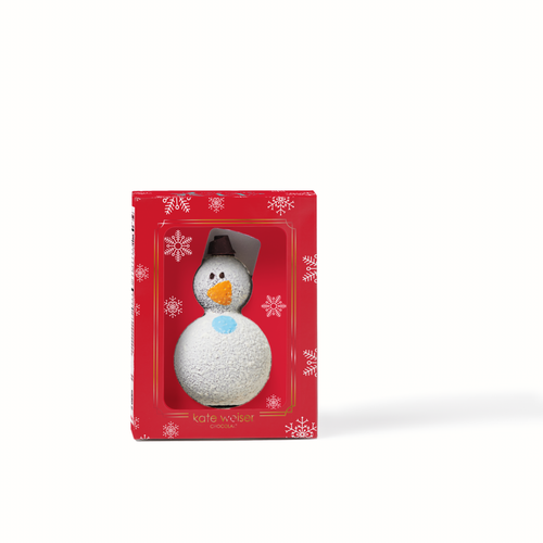 Snowman hot cocoa bomb in a red box with snowflake pattern on a white background