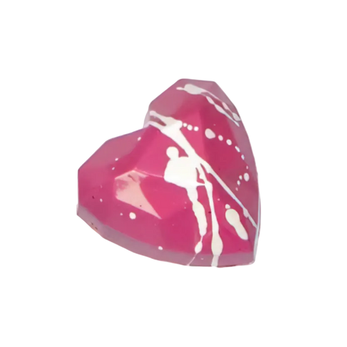 Pink heart-shaped bonbon with white abstract design on a white background