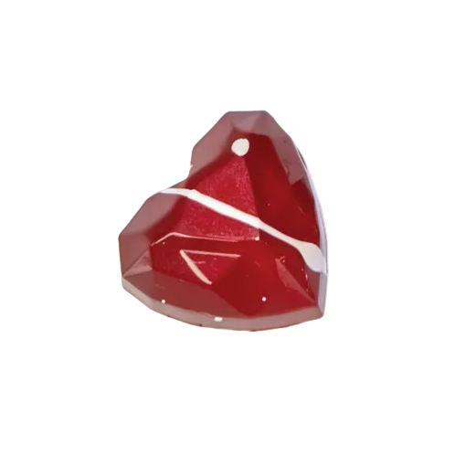 Red heart-shaped gem bonbon on a white background