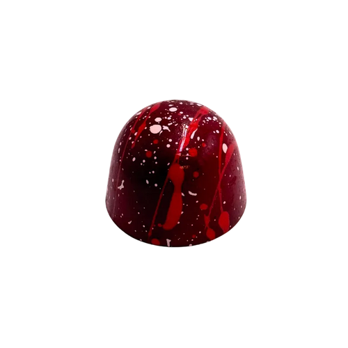 Red chocolate truffle on a white background
